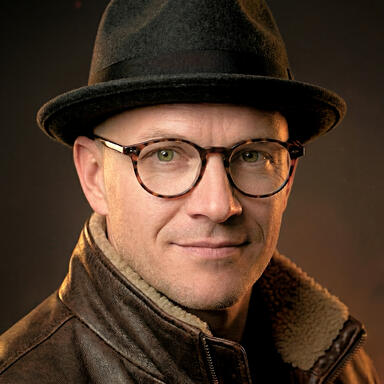 Headshot of PRAYPREY creator, Adam J. Spencer. Headshot of PRAYPREY creator and author Adam J. Spencer